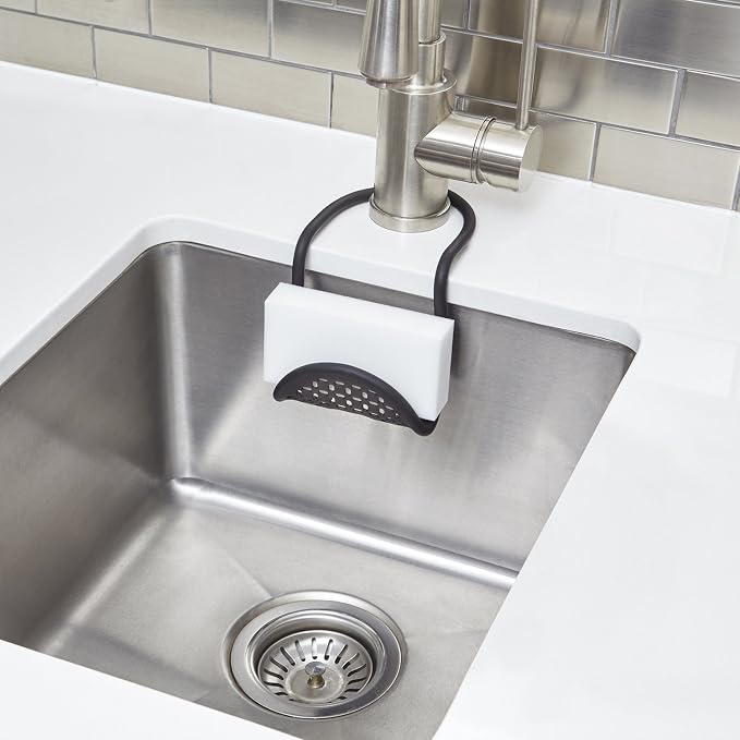 Umbra Sling Flexible Sink Caddy, Elastic Non-Slip Sponge Holder, Black | Rubber material, perforated base for drainage, prevents moisture buildup, fits faucet necks, easy rinse clean