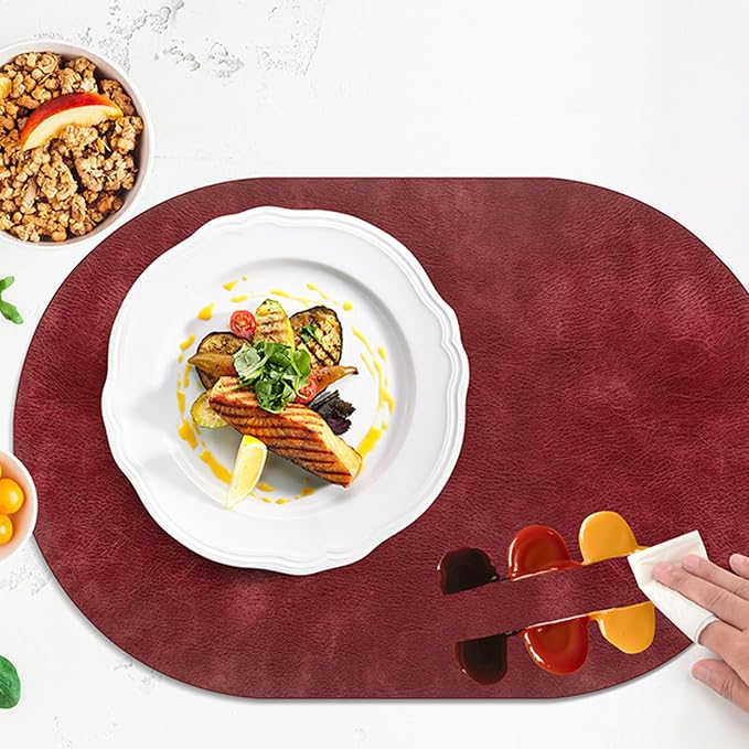 ADRIMER Placemats, Heat Resistant Oval Placemats Set of 12 Washable 12 x 17 Inch, Waterproof Table Mats, Wipeable Pu Place Mats for Kitchen, Dining Room, Wine Red