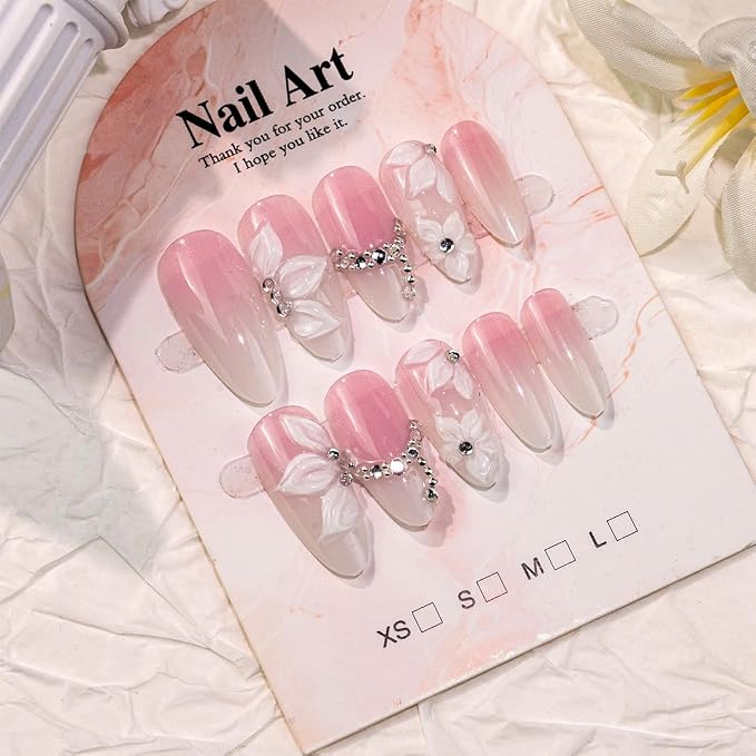 24Pcs Almond Press on Nails Medium French Tip Fake Nails with Silver Rhinestones & 3D Embossed White Flower Design Glossy Nude Pink Glue on Nails Full Cover Acrylic Nail Tips False Nails for Women