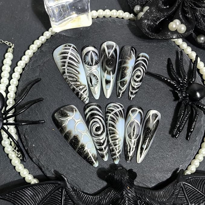 24Pcs Gothic Press on Nails Long Stiletto Fake Nails with Dark Eyes & Metallic Silver Line Design Punk Y2K Acrylic Nails Black Dark Goth Glue on Nails Reusable Stick on Nails for Women Halloween Party