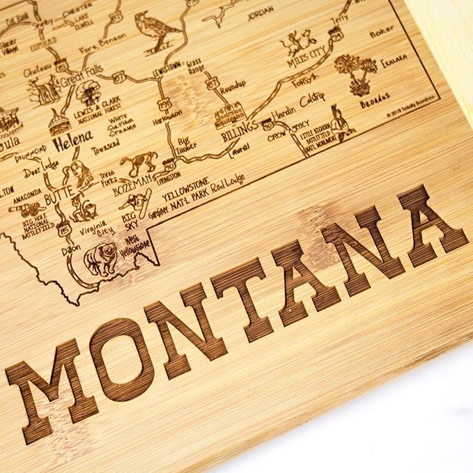 Totally Bamboo A Slice of Life Montana Engraved Map Cutting Board | 11” x 8.75” charcuterie board with engraved state map artwork. Smooth reverse side for food prep. Hang tie for wall display.