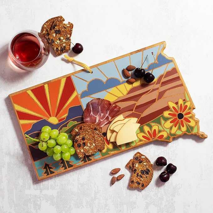 Totally Bamboo South Dakota State Shaped Cutting Board, Summer Stokes Art | State charcuterie board with colorful hand-drawn landscape art. Smooth reverse side for food prep. Hang tie for wall display.