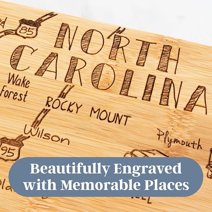 Totally Bamboo Destination North Carolina State Shaped Cutting Board | State charcuterie serving board with engraved map artwork. Smooth reverse side for food prep. Hang tie for wall display.