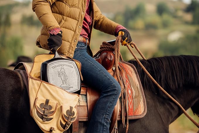 Lodge Pre-Seasoned Yellowstone Stamped Cast Iron Cookware - Signature Teardrop Handle & Assist Handle - Cowboy on Horseback 10.5 Inch Grill Pan