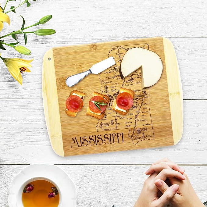 Totally Bamboo A Slice of Life Mississippi Engraved Map Cutting Board | 11” x 8.75” charcuterie board with engraved state map artwork. Smooth reverse side for food prep. Hang tie for wall display.