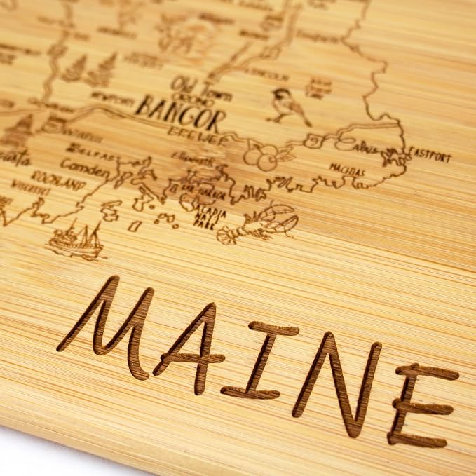 Totally Bamboo A Slice of Life Maine Engraved Map Cutting Board | 11” x 8.75” charcuterie board with engraved state map artwork. Smooth reverse side for food prep. Hang tie for wall display.