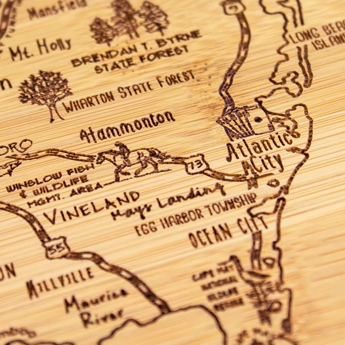 Totally Bamboo A Slice of Life New Jersey Engraved Map Cutting Board | 11” x 8.75” charcuterie board with engraved state map artwork. Smooth reverse side for food prep. Hang tie for wall display.