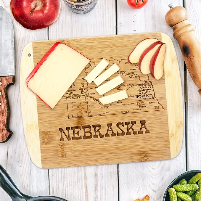 Totally Bamboo A Slice of Life Nebraska Engraved Map Cutting Board | 11” x 8.75” charcuterie board with engraved state map artwork. Smooth reverse side for food prep. Hang tie for wall display.