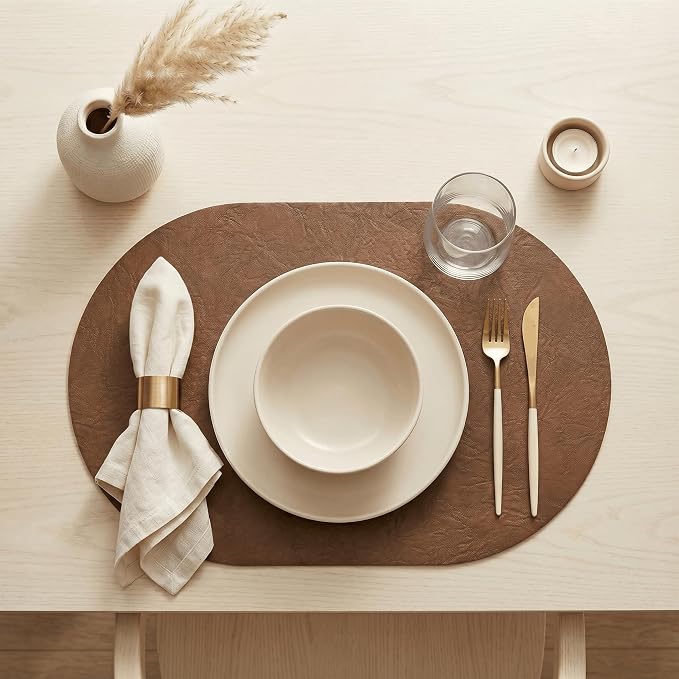 Artoid Mode Brown Faux Leather Oval Placemats Set of 6, 12 x 18 Inch Waterproof Wipeable Heat Resistant Vinyl Place Mats, Reversible Table Mats for Kitchen Dining Decor