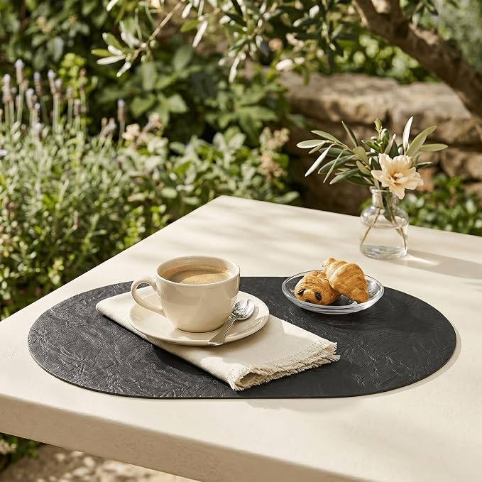 Artoid Mode Black Faux Leather Oval Placemats Set of 6, 12 x 18 Inch Waterproof Wipeable Heat Resistant Vinyl Place Mats, Reversible Table Mats for Kitchen Dining Decor
