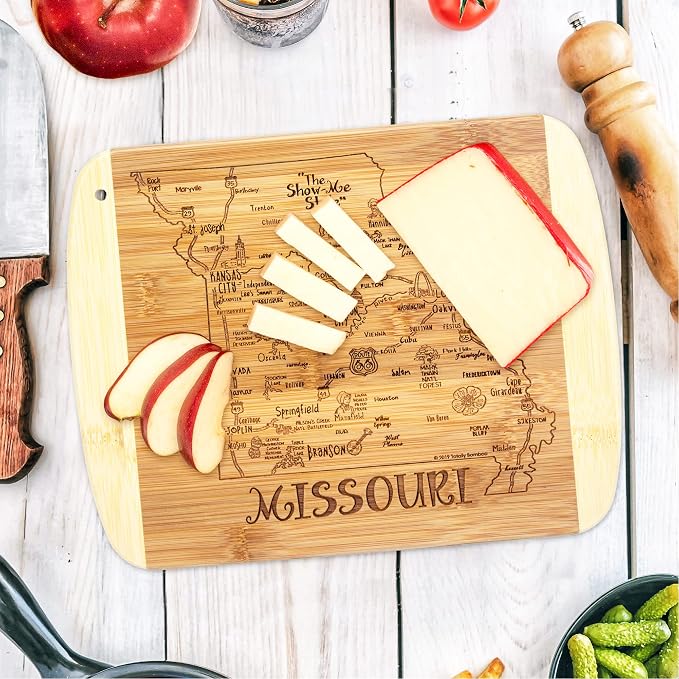 Totally Bamboo A Slice of Life Missouri Engraved Map Cutting Board | 11” x 8.75” charcuterie board with engraved state map artwork. Smooth reverse side for food prep. Hang tie for wall display.