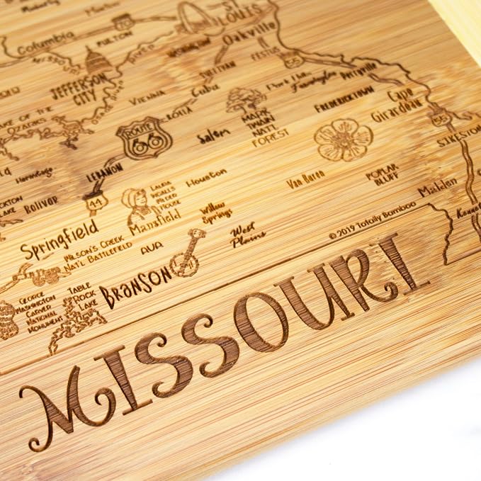 Totally Bamboo A Slice of Life Missouri Engraved Map Cutting Board | 11” x 8.75” charcuterie board with engraved state map artwork. Smooth reverse side for food prep. Hang tie for wall display.