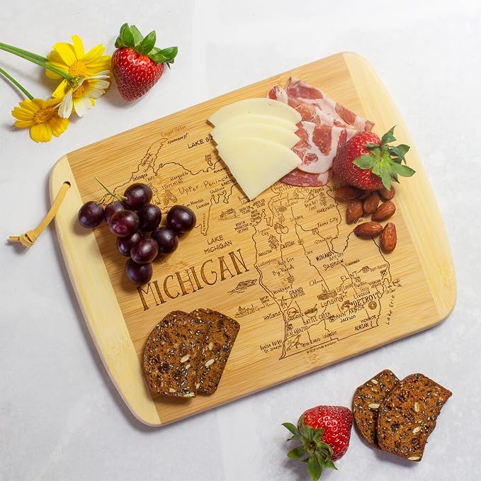 Totally Bamboo A Slice of Life Michigan Engraved Map Cutting Board | 11” x 8.75” charcuterie board with engraved state map artwork. Smooth reverse side for food prep. Hang tie for wall display.