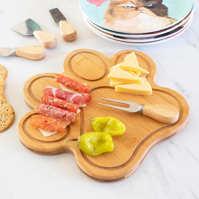 Totally Bamboo Dog Paw Shaped Cutting and Charcuterie Board, 11 x 10 in | Bamboo paw-shaped serving board with juice grooves for prep and entertaining. Built-in keyhole for easy wall display.