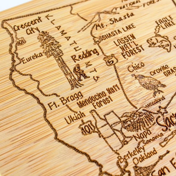 Totally Bamboo A Slice of Life California Engraved Map Cutting Board | 11” x 8.75” charcuterie board with engraved state map artwork. Smooth reverse side for food prep. Hang tie for wall display.