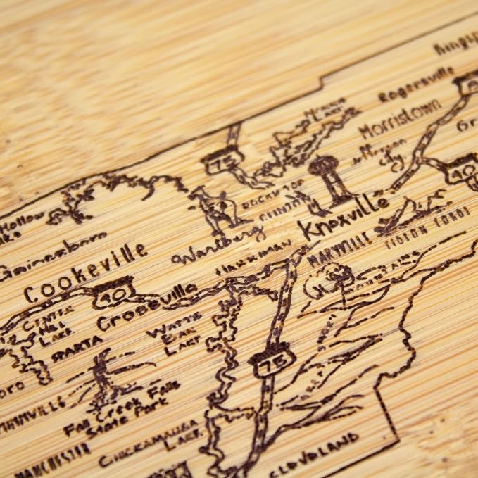 Totally Bamboo A Slice of Life Tennessee Engraved Map Cutting Board | 11” x 8.75” charcuterie board with engraved state map artwork. Smooth reverse side for food prep. Hang tie for wall display.