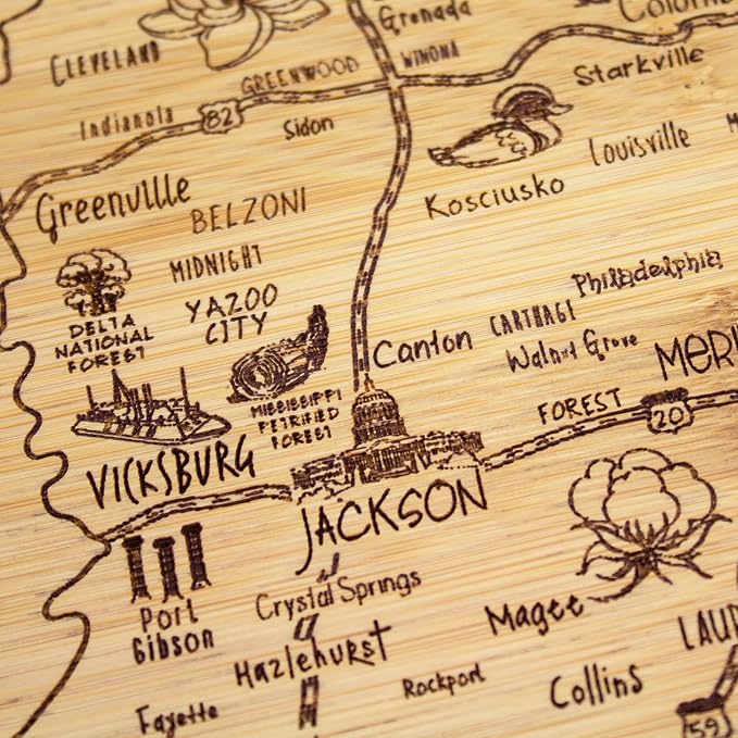 Totally Bamboo A Slice of Life Mississippi Engraved Map Cutting Board | 11” x 8.75” charcuterie board with engraved state map artwork. Smooth reverse side for food prep. Hang tie for wall display.