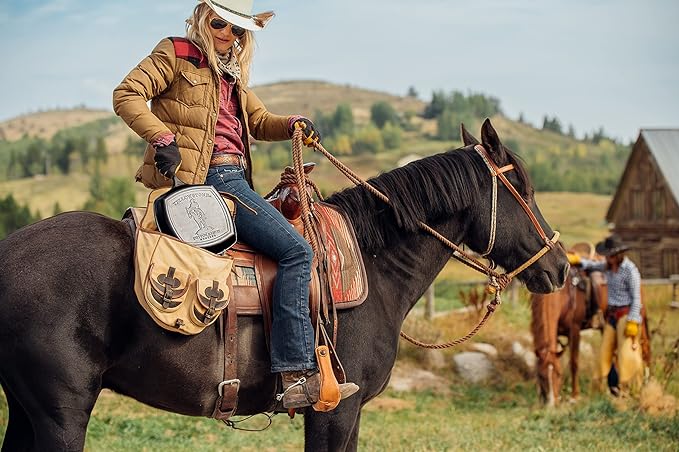 Lodge Pre-Seasoned Yellowstone Stamped Cast Iron Cookware - Signature Teardrop Handle & Assist Handle - Cowboy on Horseback 10.5 Inch Grill Pan
