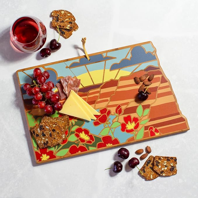 Totally Bamboo North Dakota State Shaped Cutting Board, Summer Stokes Art | State charcuterie board with colorful hand-drawn landscape art. Smooth reverse side for food prep. Hang tie for wall display.