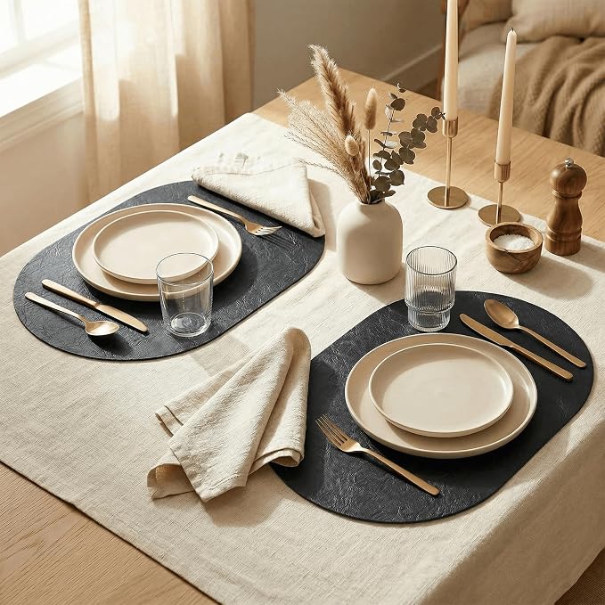 Artoid Mode Black Faux Leather Oval Placemats Set of 4, 12 x 18 Inch Waterproof Wipeable Heat Resistant Vinyl Place Mats, Reversible Table Mats for Kitchen Dining Decor
