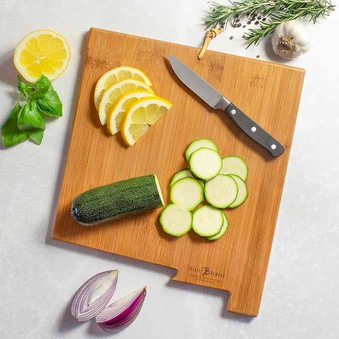 Totally Bamboo New Mexico State Shaped Cutting Board, Summer Stokes Art | State charcuterie board with colorful hand-drawn landscape art. Smooth reverse side for food prep. Hang tie for wall display.