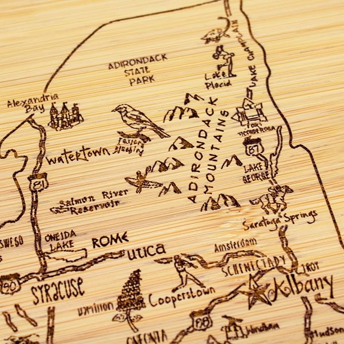 Totally Bamboo A Slice of Life New York Engraved Map Cutting Board | 11” x 8.75” charcuterie board with engraved state map artwork. Smooth reverse side for food prep. Hang tie for wall display.