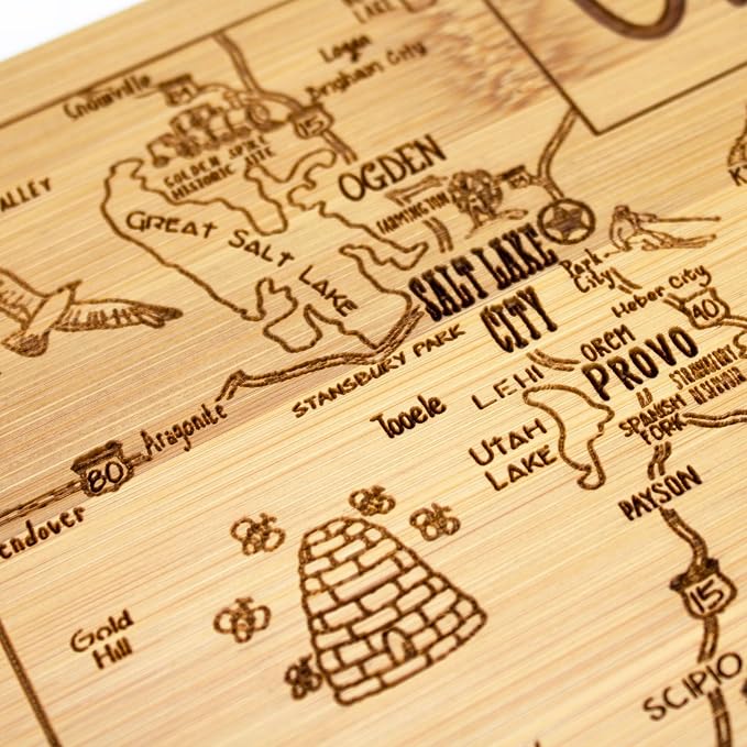 Totally Bamboo A Slice of Life Utah Engraved Map Cutting Board | 11” x 8.75” charcuterie board with engraved state map artwork. Smooth reverse side for food prep. Hang tie for wall display.