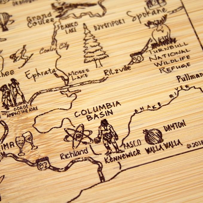Totally Bamboo A Slice of Life Washington Engraved Map Cutting Board | 11” x 8.75” charcuterie board with engraved state map artwork. Smooth reverse side for food prep. Hang tie for wall display.