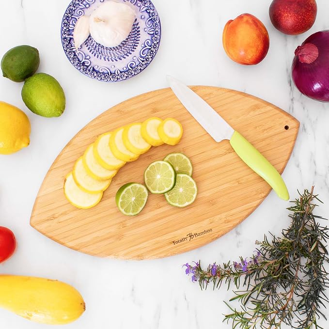 Totally Bamboo Football Shaped Cutting Board and Charcuterie Board | Football serving board for game day watch parties and tailgating. Smooth reverse side for prep. Hangs as decor between uses.