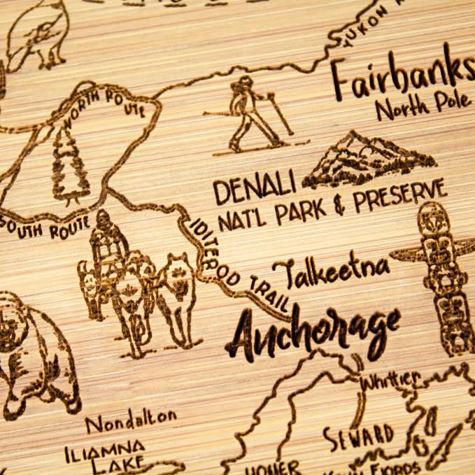 Totally Bamboo A Slice of Life Alaska Engraved Map Cutting Board | 11” x 8.75” charcuterie board with engraved state map artwork. Smooth reverse side for food prep. Hang tie for wall display.