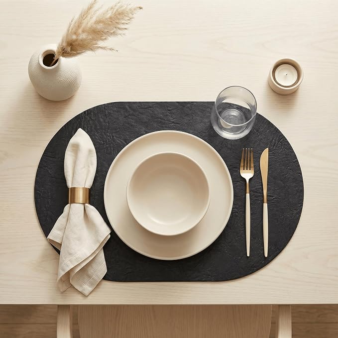 Artoid Mode Black Faux Leather Oval Placemats Set of 6, 12 x 18 Inch Waterproof Wipeable Heat Resistant Vinyl Place Mats, Reversible Table Mats for Kitchen Dining Decor