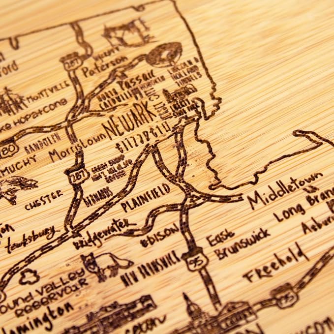 Totally Bamboo A Slice of Life New Jersey Engraved Map Cutting Board | 11” x 8.75” charcuterie board with engraved state map artwork. Smooth reverse side for food prep. Hang tie for wall display.