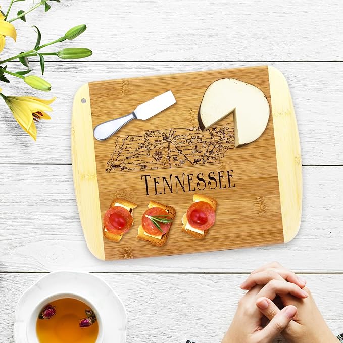 Totally Bamboo A Slice of Life Tennessee Engraved Map Cutting Board | 11” x 8.75” charcuterie board with engraved state map artwork. Smooth reverse side for food prep. Hang tie for wall display.