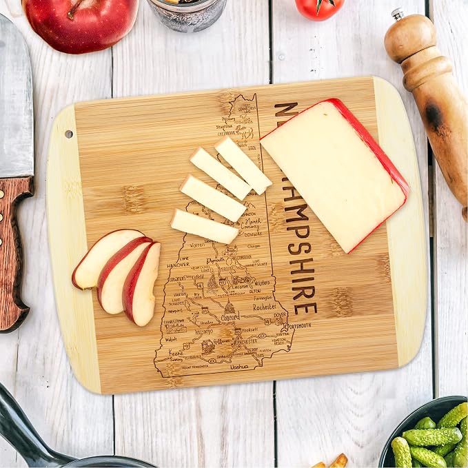 Totally Bamboo A Slice of Life New Hampshire Engraved Map Cutting Board | 11” x 8.75” charcuterie board with engraved state map artwork. Smooth reverse side for food prep. Hang tie for wall display.
