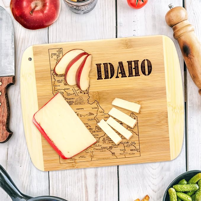 Totally Bamboo A Slice of Life Idaho Engraved Map Cutting Board | 11” x 8.75” charcuterie board with engraved state map artwork. Smooth reverse side for food prep. Hang tie for wall display.
