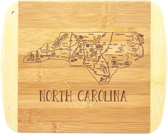 Totally Bamboo A Slice of Life North Carolina Engraved Map Cutting Board | 11” x 8.75” charcuterie board with engraved state map artwork. Smooth reverse side for food prep. Hang tie for wall display.