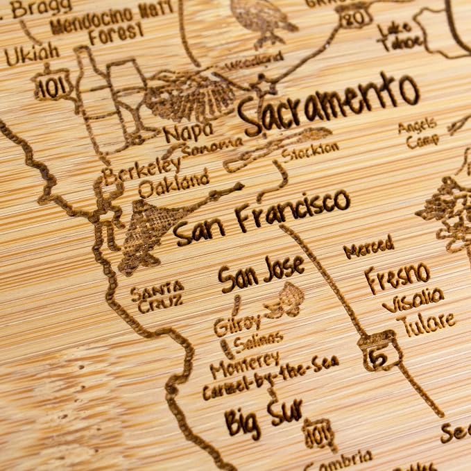Totally Bamboo A Slice of Life California Engraved Map Cutting Board | 11” x 8.75” charcuterie board with engraved state map artwork. Smooth reverse side for food prep. Hang tie for wall display.
