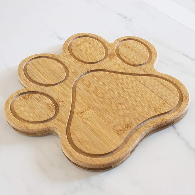 Totally Bamboo Dog Paw Shaped Cutting and Charcuterie Board, 11 x 10 in | Bamboo paw-shaped serving board with juice grooves for prep and entertaining. Built-in keyhole for easy wall display.