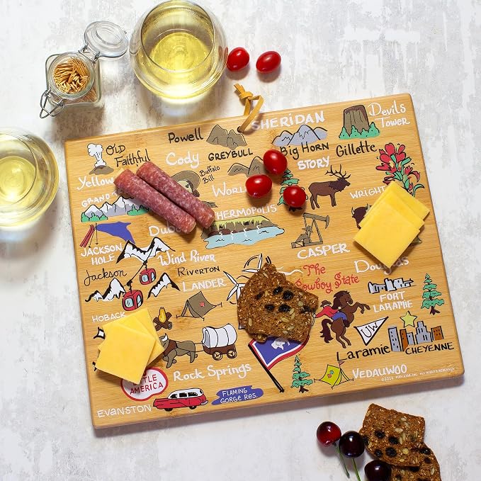 Totally Bamboo Wyoming State Shaped Cutting Board, Art by Fish Kiss | State charcuterie board with colorful hand-drawn map artwork. Smooth reverse side for food prep. Hang tie for wall display.
