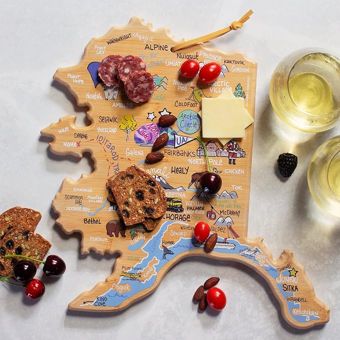 Totally Bamboo Alaska State Shaped Cutting Board, Art by Fish Kiss | State charcuterie board with colorful hand-drawn map artwork. Smooth reverse side for food prep. Hang tie for wall display.