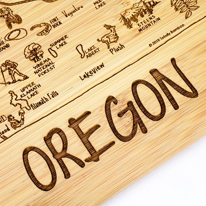 Totally Bamboo A Slice of Life Oregon Engraved Map Cutting Board | 11” x 8.75” charcuterie board with engraved state map artwork. Smooth reverse side for food prep. Hang tie for wall display.