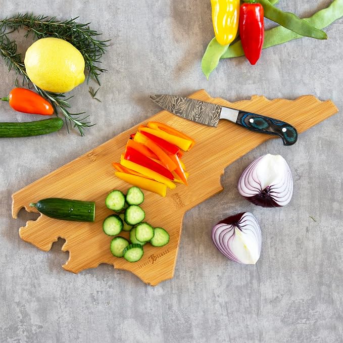 Totally Bamboo North Carolina State Shaped Cutting Board, Art by Fish Kiss | State charcuterie board with colorful hand-drawn map artwork. Smooth reverse side for food prep. Hang tie for wall display.