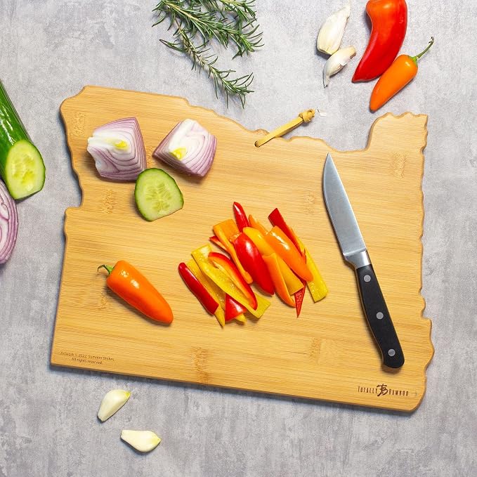 Totally Bamboo Oregon State Shaped Cutting Board, Summer Stokes Art | State charcuterie board with colorful hand-drawn landscape art. Smooth reverse side for food prep. Hang tie for wall display.