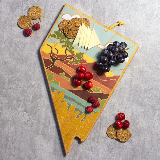 Totally Bamboo Nevada State Shaped Cutting Board, Summer Stokes Art | State charcuterie board with colorful hand-drawn landscape art. Smooth reverse side for food prep. Hang tie for wall display.