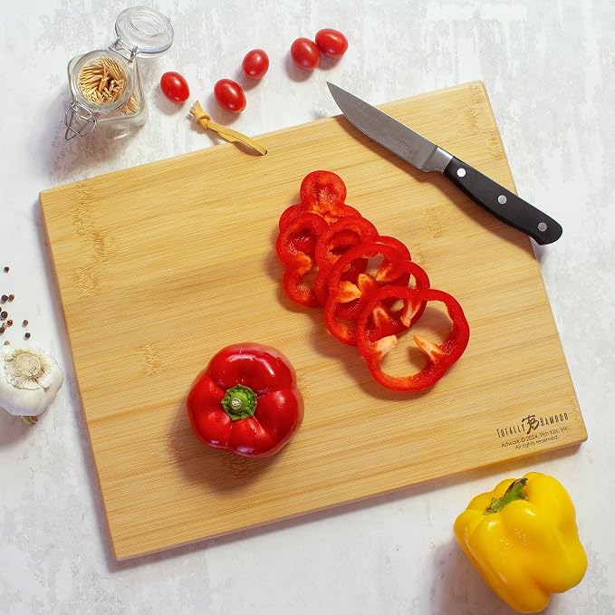 Totally Bamboo Wyoming State Shaped Cutting Board, Art by Fish Kiss | State charcuterie board with colorful hand-drawn map artwork. Smooth reverse side for food prep. Hang tie for wall display.