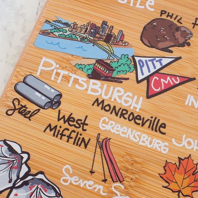 Totally Bamboo Pennsylvania State Shaped Cutting Board, Art by Fish Kiss | State charcuterie board with colorful hand-drawn map artwork. Smooth reverse side for food prep. Hang tie for wall display.