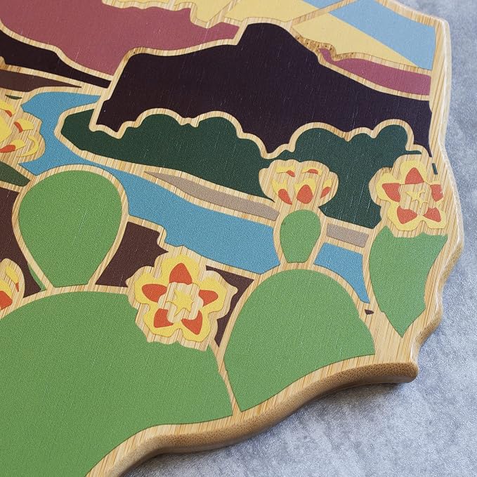 Totally Bamboo Texas State Shaped Cutting Board, Summer Stokes Art | State charcuterie board with colorful hand-drawn landscape art. Smooth reverse side for food prep. Hang tie for wall display.