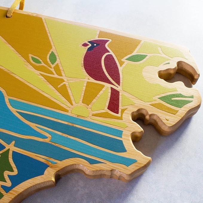 Totally Bamboo North Carolina State Shaped Cutting Board, Summer Stokes Art | State charcuterie board with colorful hand-drawn landscape art. Smooth reverse side for food prep. Hang tie for wall display.