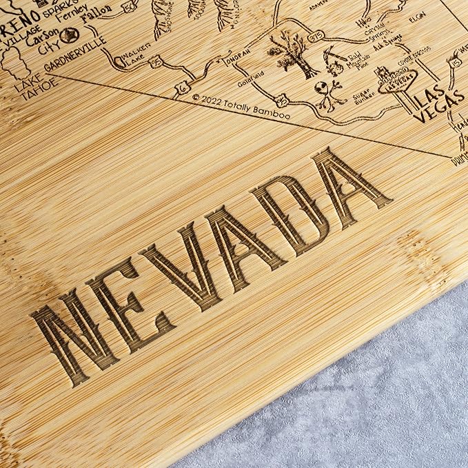 Totally Bamboo A Slice of Life Nevada Engraved Map Cutting Board | 11” x 8.75” charcuterie board with engraved state map artwork. Smooth reverse side for food prep. Hang tie for wall display.