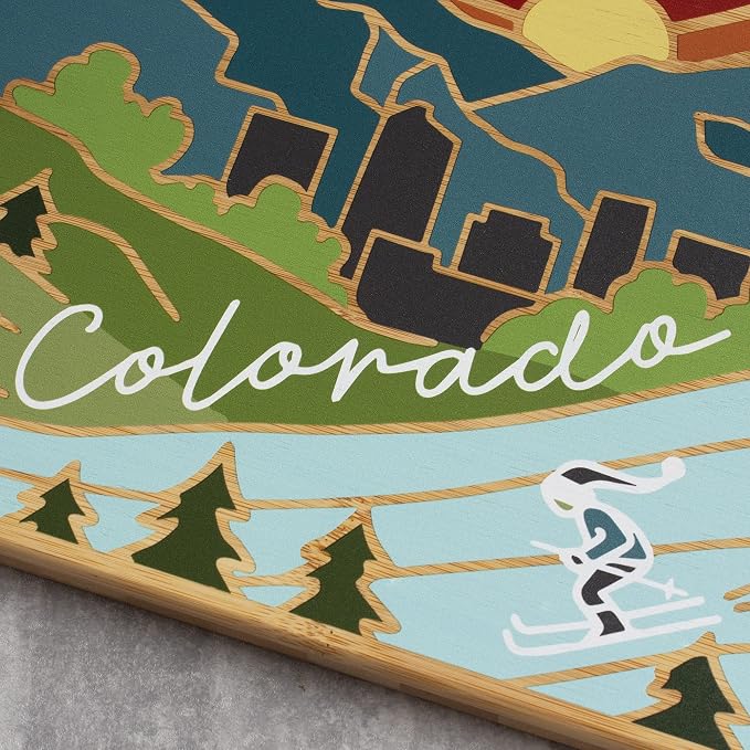 Totally Bamboo Colorado State Shaped Cutting Board, Summer Stokes Art | State charcuterie board with colorful hand-drawn landscape art. Smooth reverse side for food prep. Hang tie for wall display.